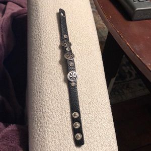 Leather bracelet with silver embellishments.